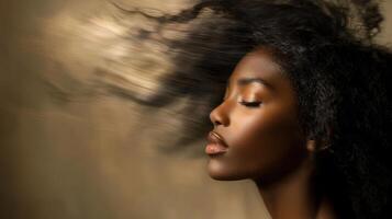 A beautiful young woman with her hair blowing in the wind photo