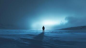 A person standing in the middle of a snowy field photo