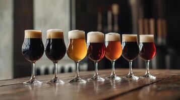 A row of beer glasses lined up on a table photo