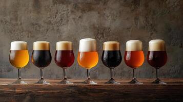 Six different types of beer in glasses on a wooden table photo