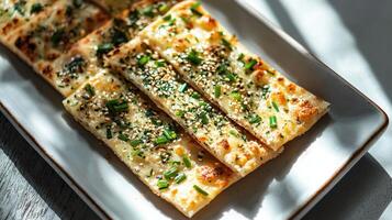 A white plate topped with bread slices photo