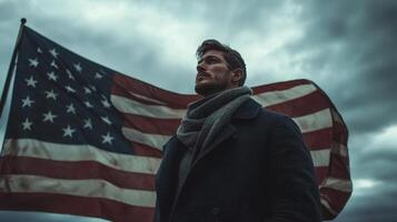 Man standing in front of an american flag photo
