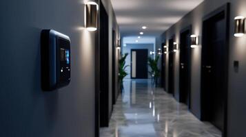A hallway with a light switch and a door photo