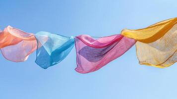 Colorful cloths hanging on a clothesline photo