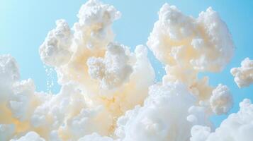 Fluffy white clouds create a dreamy atmosphere against a vivid blue background. The soft textures and bright colors evoke a sense of tranquility and wonder in the sky photo