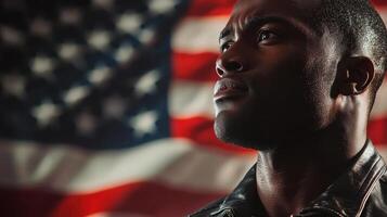A man stands in profile, gazing thoughtfully upwards, with an American flag prominently displayed in the background, evoking feelings of pride and reflection photo