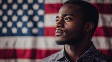 A young man in front of an american flag photo