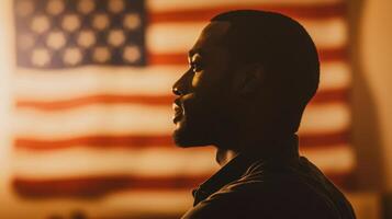 A man in front of an american flag photo