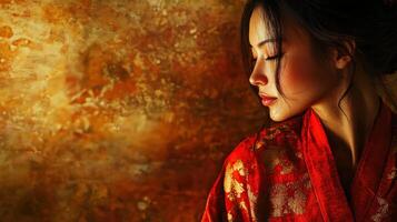 A woman in a red kimono is looking down photo