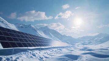 Rows of solar panels stand out against a snowy mountain backdrop, reflecting sunlight under a clear blue sky with scattered clouds, highlighting renewable energy use in winter photo