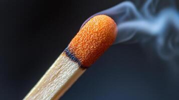 A matchstick with smoke coming out of it photo