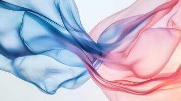 Two blue and pink colored fabric in the air photo