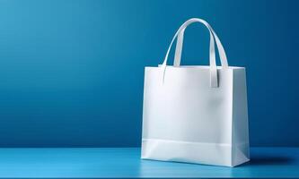 White paper bag on blue background photo