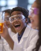 Excited young scientist in lab coat and goggles holding a beaker, exploring chemistry in a vibrant laboratory environment. photo