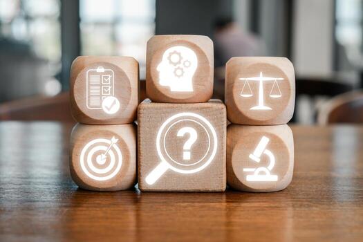 Wooden blocks with icons symbolizing critical thinking concepts like analysis, decision-making, and problem-solving. photo