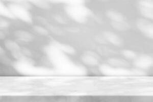 Marble Table with Tree Shadow in the Garden on Concrete Wall Texture Background photo