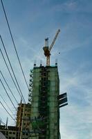 a crane is on top of a building under construction photo