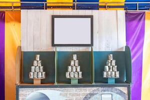 Tower of cans in front for throwing game at fun fair, Game shoot canned for outing party, photo