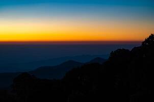 The beautiful sunrise at Doi intanon national park, Chiang Mai in the morning.Sun is rising from the hill to shy with beautiful light. photo