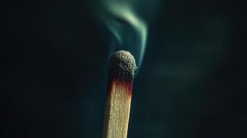 A matchstick with a black background photo