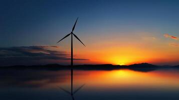 Wind turbine at sunset with reflection photo