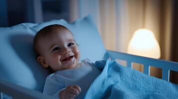A baby smiling in a crib at night photo