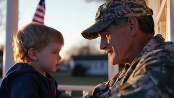 A soldier and a child sitting on a porch photo