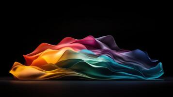 A colorful wave of fabric is displayed on a black background photo