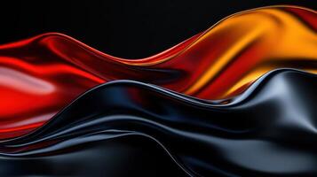 A long red, black and orange fabric with a wave pattern photo