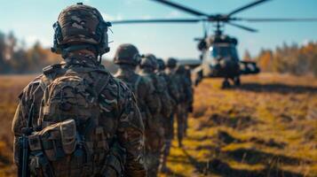 Soldiers line up in formation near a military helicopter during a training exercise in a woodland area, showcasing teamwork and readiness in the autumn landscape. photo