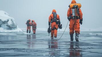 Scientists in bright orange suits walk across a frozen landscape, utilizing equipment for research and data collection in a remote polar area on a cold morning. photo