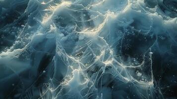 Light filters through layers of ice and water, showcasing incredible textures and patterns in a tranquil winter landscape illuminated by the soft glow of morning sunlight. photo