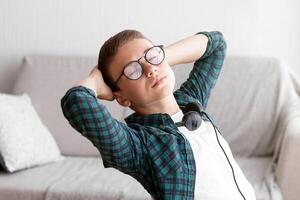 Exhausted schooler sleeping while preparing to exams at home, side view, copy space photo