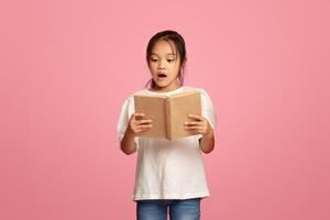 Focused diverse schoolkids reading books on pink background photo