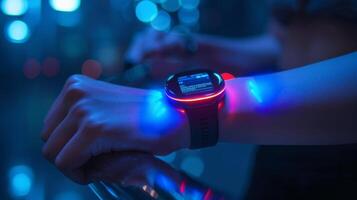 A hand wearing a glowing smartwatch highlights the device's features while surrounded by a colorful cityscape illuminated by neon lights during nighttime. photo