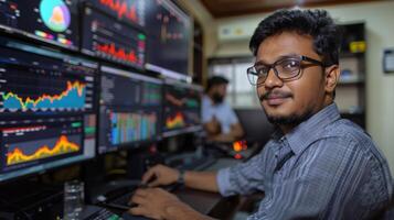 In a modern trading environment, two individuals focus on analyzing financial charts and data on large screens, immersed in the world of stock market trading and analysis. photo