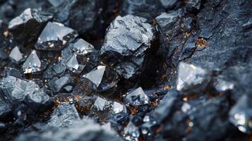 A stunning natural arrangement of sparkling crystals and dark stones creates a captivating visual display in a rocky terrain, highlighting the beauty of geological formations. photo
