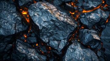 Rough lava rocks display dark textures while glowing molten lava seeps between them, highlighting a dramatic volcanic landscape formed by intense geological activity. photo