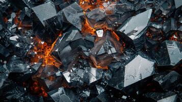 Shattered crystals display sharp angles and surfaces with a captivating orange glow emanating from the center, creating a striking contrast against the dark background, enhancing texture and depth. photo