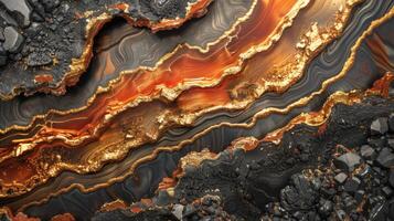 Striking geological formation displaying wavy layers of orange and gold minerals contrasted by dark rock textures, illuminated to reveal intricate details and unique patterns photo
