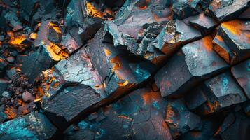 A close up view of fragmented rock surfaces reveals an array of colors and textures. Bright orange, blue, and natural grays are evident, highlighting geological features. photo