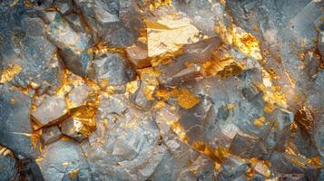 Shimmering gold veins are embedded in rough rock surfaces, creating a striking contrast with the gray mineral layers, showcasing nature's artistry in geology and mineralogy. photo