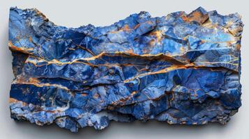A stunning blue mineral formation displays vivid blue and orange patterns creating a vibrant visual texture, making it a captivating piece in a natural history exhibit. photo