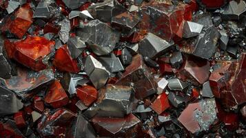 An array of polished gemstones highlights rich colors and diverse textures found in a mineral deposit. The gems display shades of red and black, reflecting light with distinct patterns. photo