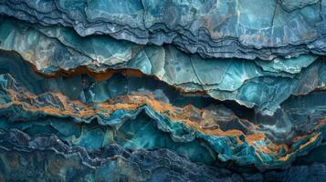Textured layers of blue and teal rocks show natural formations, highlighted by striking orange lines that add contrast to the geological masterpiece, emphasizing the intricate design of nature. photo