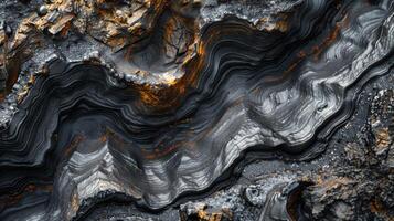 Intricate lines and colors in this rock formation showcase the natural beauty of geological processes, creating a stunning visual representation of Earth's history. photo