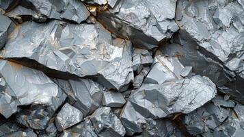 This close up view showcases a natural rock formation characterized by various shades of gray, sharp edges, and unique textures, highlighting its geological composition. photo