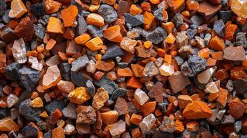 A diverse array of small pebbles and crystals presents a striking display of colors and textures. photo