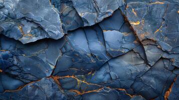 Beautiful blue slate rock reveals layered textures and vibrant colors. The natural patterns highlight geological processes at work over time, creating a stunning visual display. photo