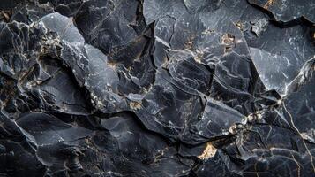 Close up view of a textured black rock surface reveals intricate patterns and natural lines formed over time, highlighting the beauty of geological formations in a striking display of nature photo